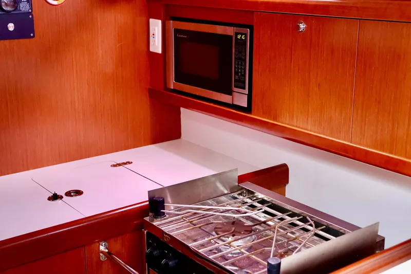 Slide: The Image of The galley of a 2011 Beneteau 40 featuring a stove and microwave. - 9