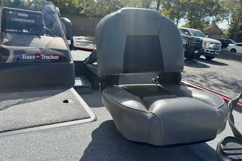 Slide: The Image of 2025 Tracker Bass Tracker Classic XL boat seat and console in sunlight. - 15