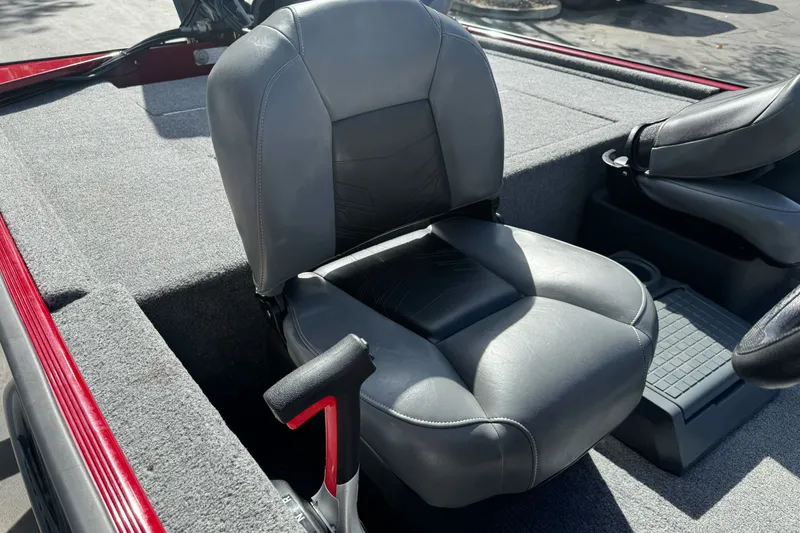 Slide: The Image of 2025 Tracker Bass Tracker Classic XL boat seat with gray upholstery and red accents. - 13