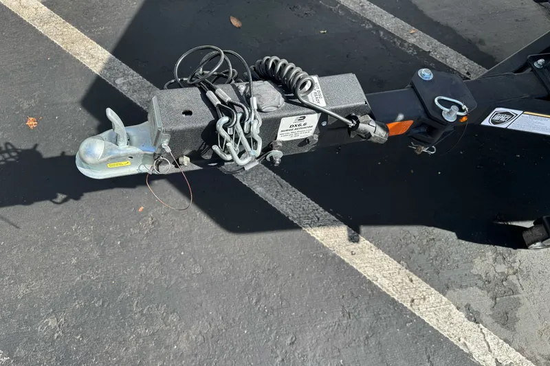 Slide: The Image of Trailer hitch of 2025 Tracker Bass Tracker Classic XL in parking lot. - 16
