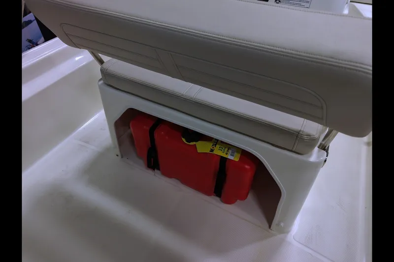 Slide: The Image of Boston Whaler 150 Montauk 2027 boat seat with red storage compartment underneath. - 10