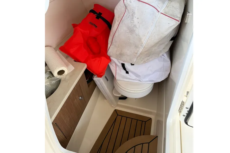 Slide: The Image of Interior of 2019 Boston Whaler 270 Vantage boat with storage items. - 30