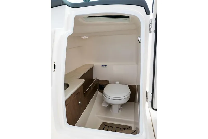 Slide: The Image of Manufacturer Provided Image: 2019 Boston Whaler 270 Vantage boat interior bathroom with toilet and sink. - 34