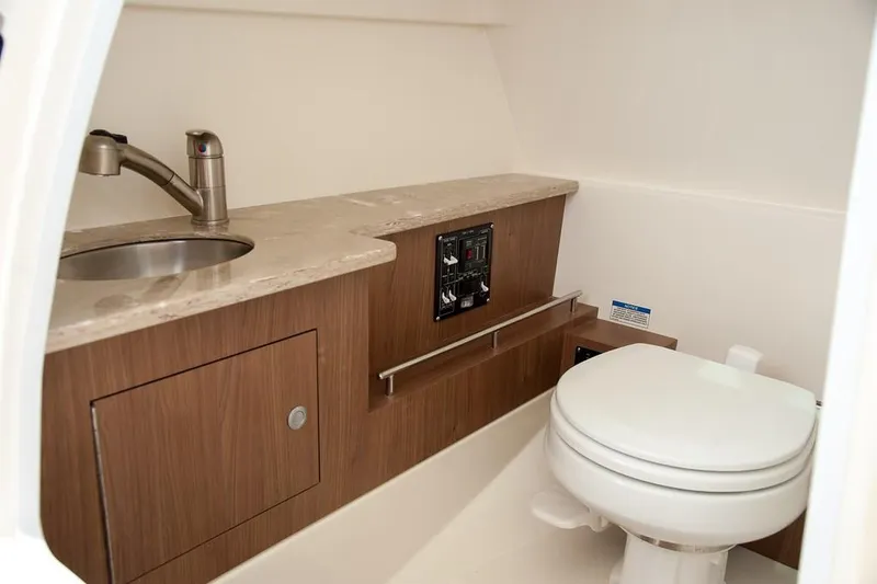 Slide: The Image of Manufacturer Provided Image: 2019 Boston Whaler 270 Vantage boat interior bathroom with sink and toilet. - 33