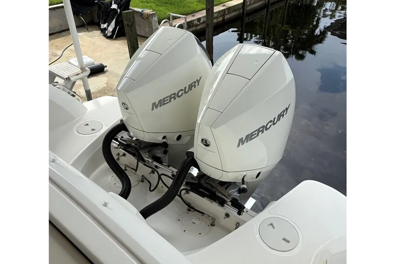 Slide: The Image of Twin Mercury outboard engines on a 2019 Boston Whaler 270 Vantage boat. - 7