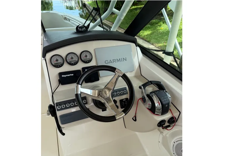Slide: The Image of 2019 Boston Whaler 270 Vantage helm with Garmin and Raymarine electronics. - 10