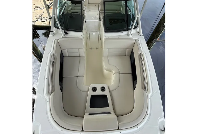 Slide: The Image of 2019 Boston Whaler 270 Vantage boat interior with spacious seating and cup holders. - 13