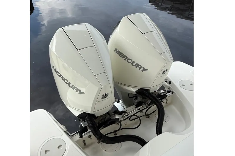 Slide: The Image of Twin Mercury outboard engines on a 2019 Boston Whaler 270 Vantage boat. - 8