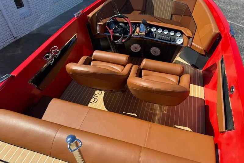 Slide: The Image of 2007 Frauscher 686 Lido boat interior with brown leather seats and red accents. - 12