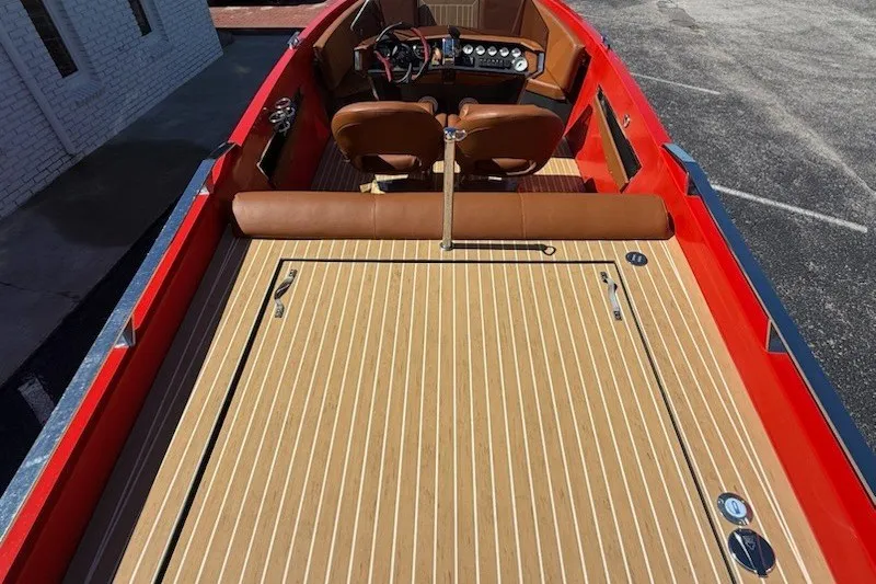 Slide: The Image of 2007 Frauscher 686 Lido boat with red exterior and wooden deck. - 14