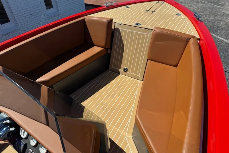 Slide: The Image of 2007 Frauscher 686 Lido boat interior with brown seating and red exterior. - 5