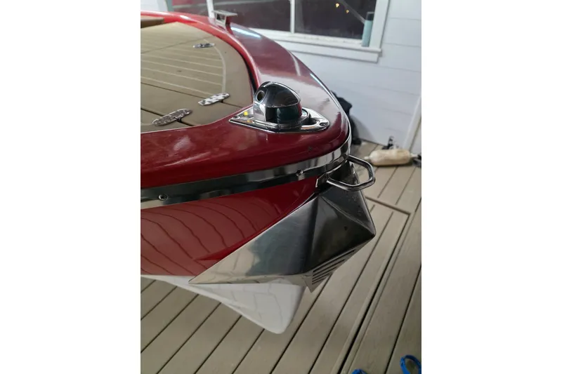 Slide: The Image of Red Frauscher 686 Lido boat bow detail, 2007 model, on wooden deck. - 21