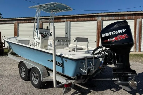 Slide: The Image of 2015 Mako 21 LTS boat with Mercury Pro XS engine on a trailer. - 1