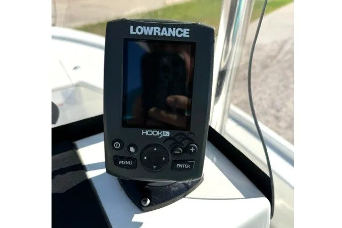 Slide: The Image of A Lowrance HOOK 3x fish finder is mounted on a boat. - 9
