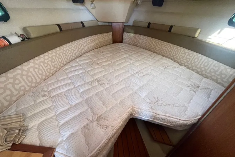Slide: The Image of Cozy cabin interior of 2018 Ranger Tug R-27 with comfortable bedding. - 20