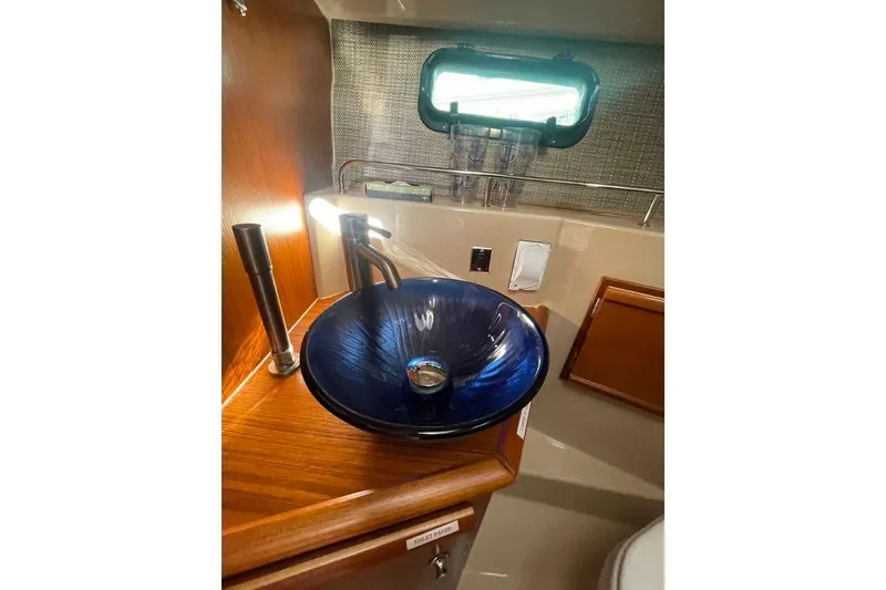 Slide: The Image of Elegant blue glass sink in 2018 Ranger Tug R-27 boat bathroom. - 23