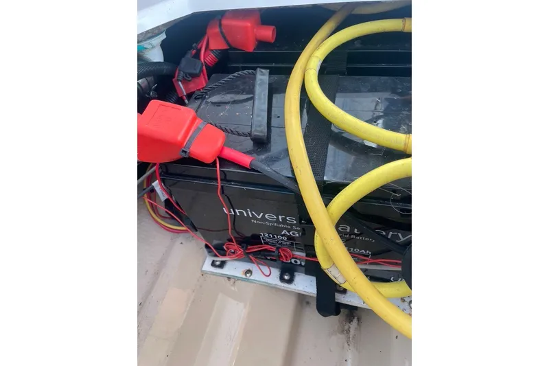 Slide: The Image of Battery compartment of 2018 Ranger Tug R-27 with cables and connectors. - 33