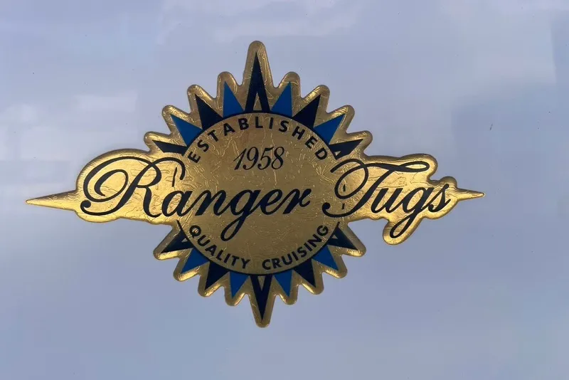 Slide: The Image of Ranger Tugs emblem, established 1958, quality cruising, gold and blue design, 2018 R-27 model. - 41