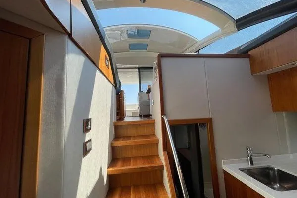 Slide: The Image of Interior view of 2016 Sunseeker Predator 57 yacht with wooden stairs and skylight. - 41