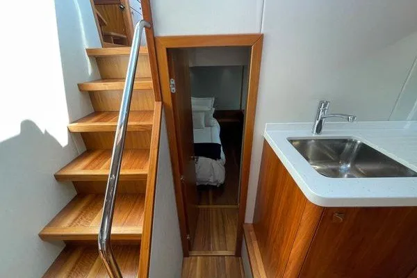 Slide: The Image of Interior of 2016 Sunseeker Predator 57 yacht with wooden stairs and compact kitchenette. - 46