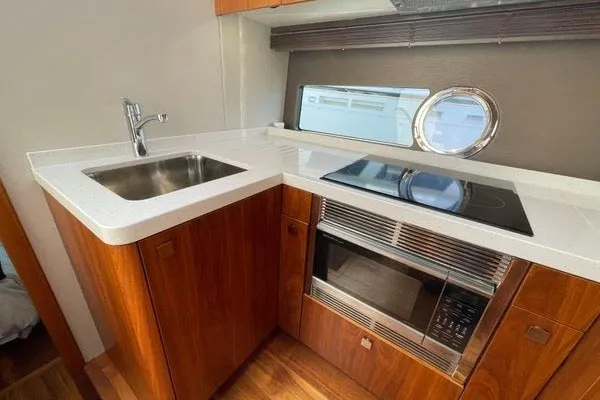 Slide: The Image of Modern kitchen in 2016 Sunseeker Predator 57 yacht with sink, stove, and microwave. - 45