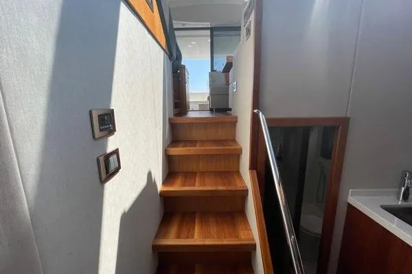 Slide: The Image of Interior stairs of 2016 Sunseeker Predator 57 yacht with wooden steps and modern design. - 42
