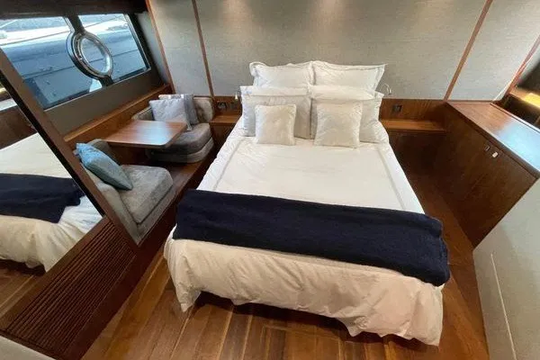 Slide: The Image of Luxurious cabin interior of 2016 Sunseeker Predator 57 yacht with cozy bed and seating area. - 49