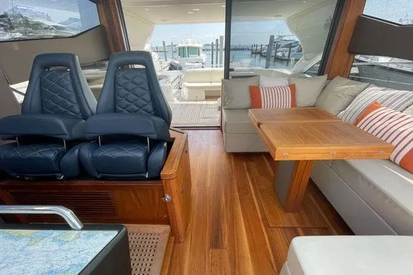 Slide: The Image of Luxurious interior of 2016 Sunseeker Predator 57 yacht with elegant seating and wooden flooring. - 26