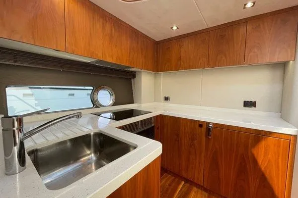 Slide: The Image of Luxurious kitchen interior of 2016 Sunseeker Predator 57 yacht with wooden cabinetry. - 44
