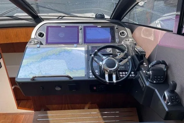 Slide: The Image of Helm of 2016 Sunseeker Predator 57 yacht with navigation screens and controls. - 22