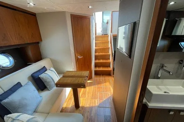 Slide: The Image of Interior of 2016 Sunseeker Predator 57 yacht with wooden flooring and cozy seating area. - 36