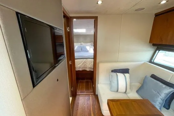 Slide: The Image of Luxurious interior of 2016 Sunseeker Predator 57 yacht with cozy seating and TV. - 31