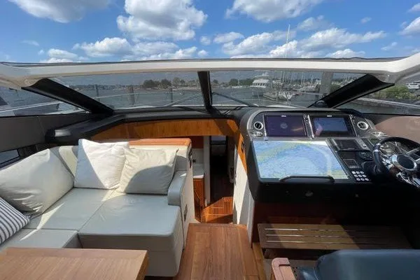 Slide: The Image of Interior view of 2016 Sunseeker Predator 57 yacht with modern helm and seating area. - 20