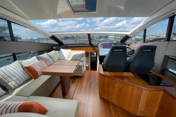 Slide: The Image of Luxurious interior of 2016 Sunseeker Predator 57 yacht with plush seating and wooden accents. - 15