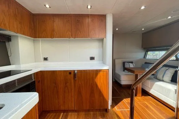 Slide: The Image of Luxurious interior of 2016 Sunseeker Predator 57 yacht with modern kitchen and seating area. - 47
