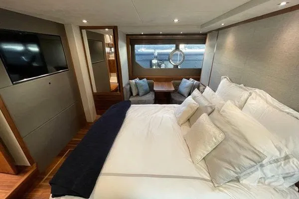 Slide: The Image of Luxurious interior of 2016 Sunseeker Predator 57 yacht with elegant bedroom and seating area. - 51