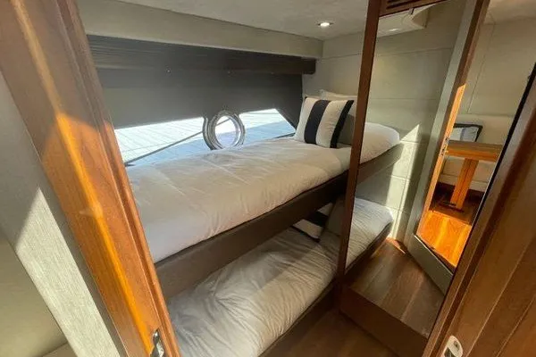Slide: The Image of Interior cabin of 2016 Sunseeker Predator 57 yacht with bunk beds and porthole. - 39
