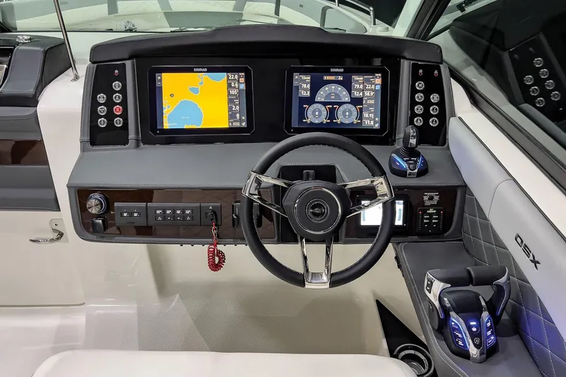 Slide: The Image of Manufacturer Provided Image: 2025 Chaparral 310 OSX boat dashboard with dual navigation screens and modern controls. - 7