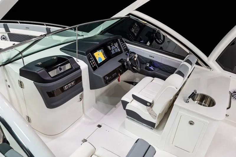 Slide: The Image of Manufacturer Provided Image: 2025 Chaparral 310 OSX boat interior with modern dashboard and seating. - 5