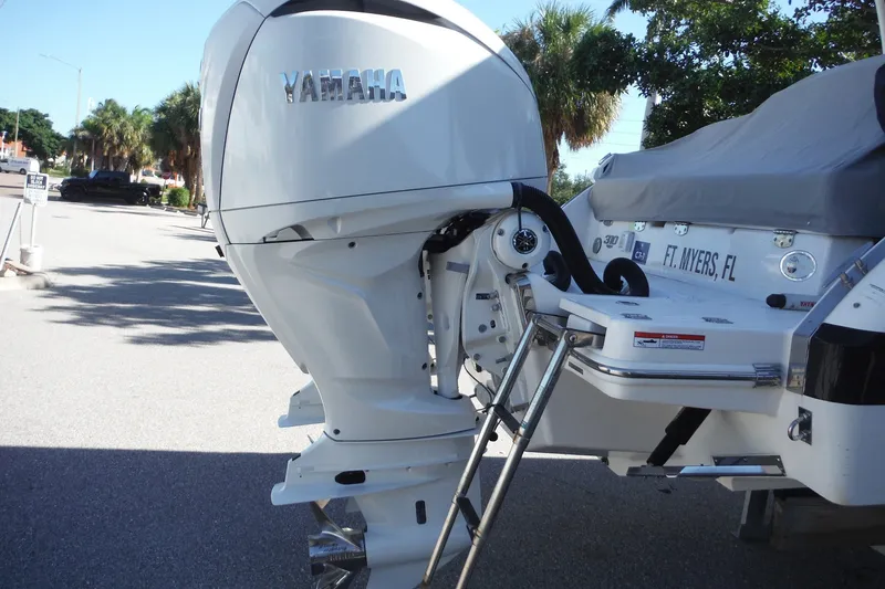 Slide: The Image of 2025 Chaparral 310 OSX boat with Yamaha outboard motor, docked in Fort Myers, FL. - 62