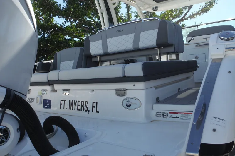 Slide: The Image of 2025 Chaparral 310 OSX boat interior, featuring seating and details, located in Ft. Myers, FL. - 28