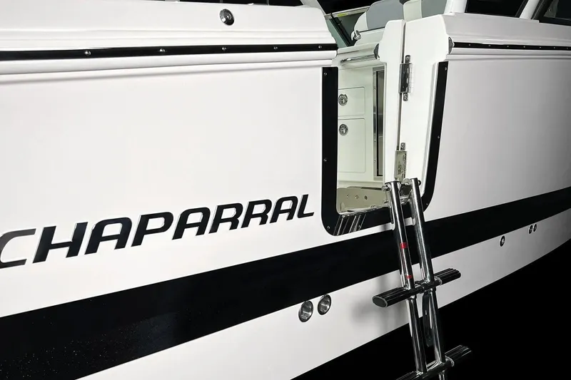 Slide: The Image of Manufacturer Provided Image: 2025 Chaparral 310 OSX boat with side entry ladder and sleek design. - 12