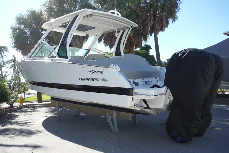 Slide: The Image of 2025 Chaparral 310 OSX boat on display, featuring sleek design and modern amenities. - 75