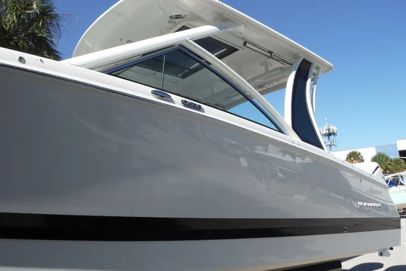 Slide: The Image of 2025 Chaparral 310 OSX boat with sleek design and modern features. - 25