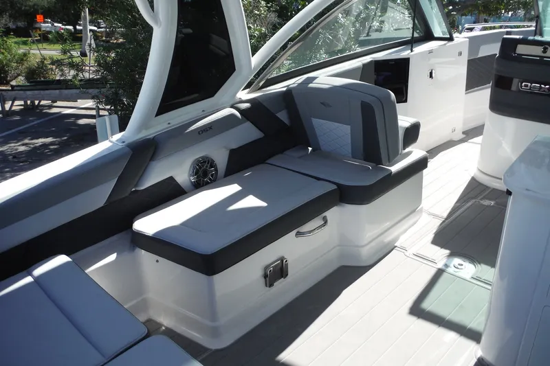 Slide: The Image of 2025 Chaparral 310 OSX boat interior with sleek seating and modern design. - 36