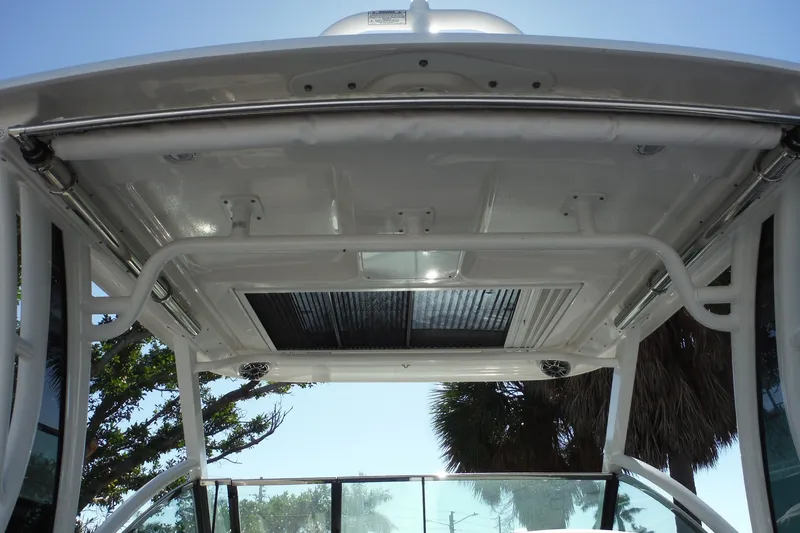 Slide: The Image of 2025 Chaparral 310 OSX boat roof with sleek design and integrated lighting. - 73