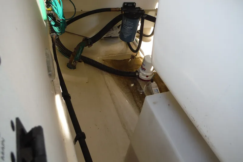 Slide: The Image of Bilge area of 2025 Chaparral 310 OSX boat with hoses and pump components. - 46