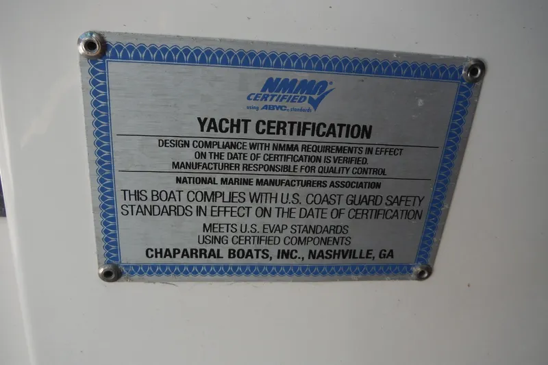 Slide: The Image of Yacht certification plaque for 2025 Chaparral 310 OSX, NMMA and U.S. Coast Guard compliant. - 52