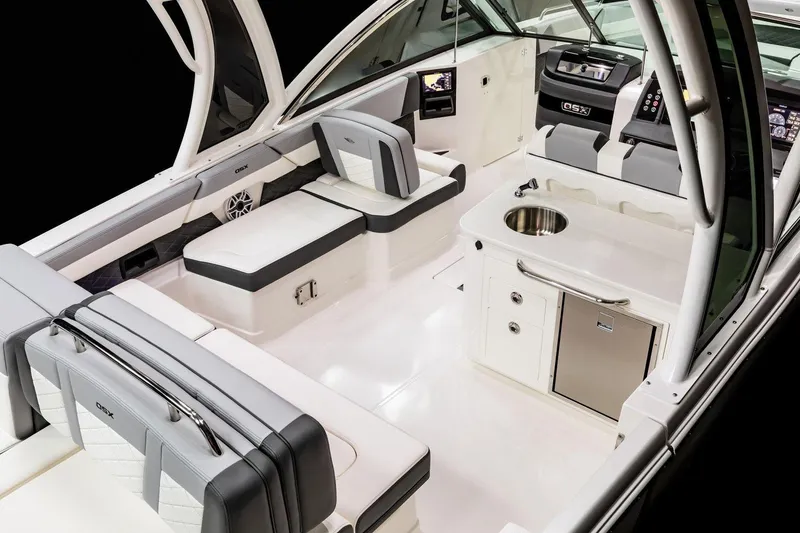 Slide: The Image of Manufacturer Provided Image: 2025 Chaparral 310 OSX boat interior with sleek seating and modern amenities. - 10