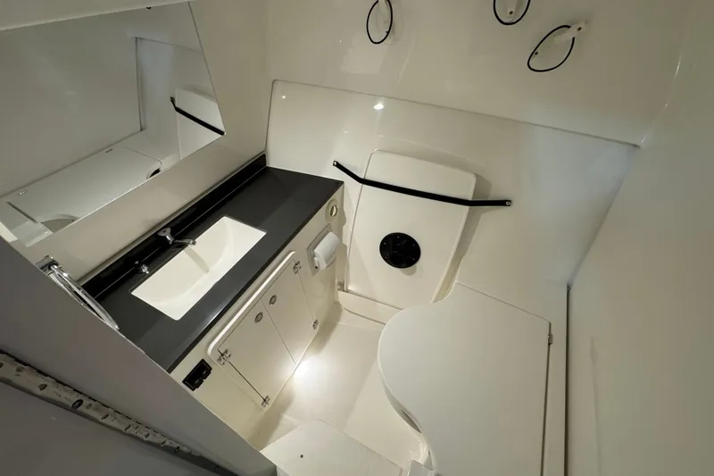 Slide: The Image of Modern bathroom interior of 2026 Pursuit DC 326 Dual Console boat. - 30